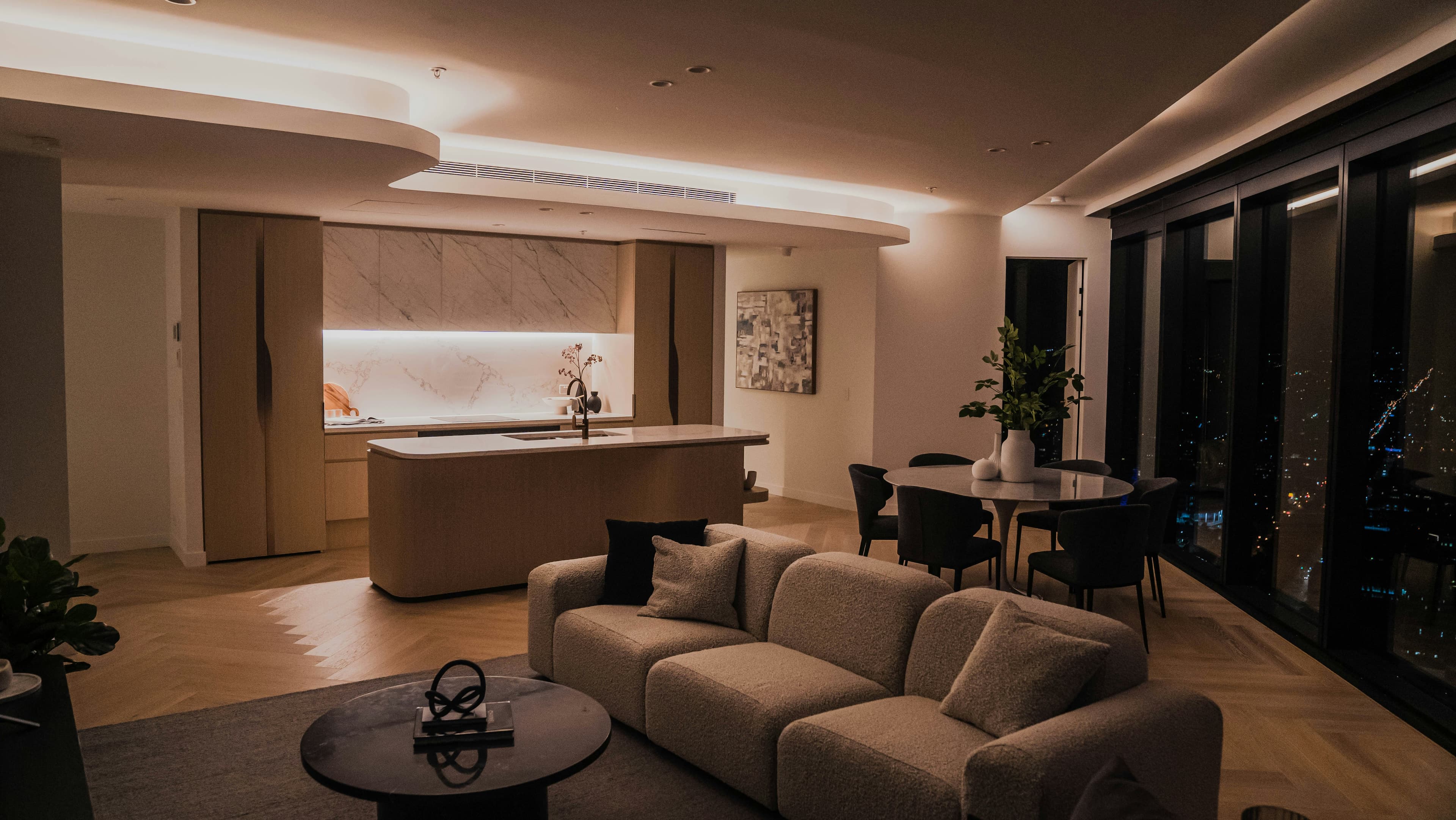 Elegant living room with a night-time city view